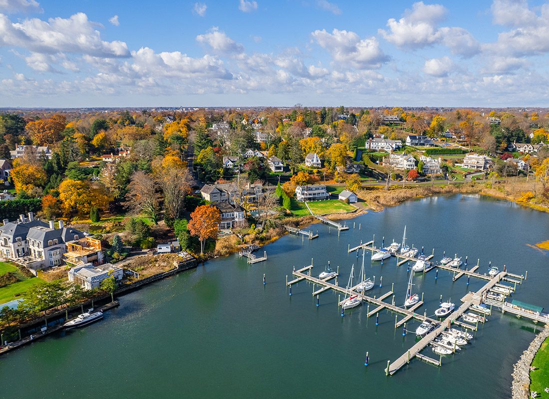 Stamford, CT - Aerial View of Stamford, CT With Boats Parked in a Lake on a Sunny Day